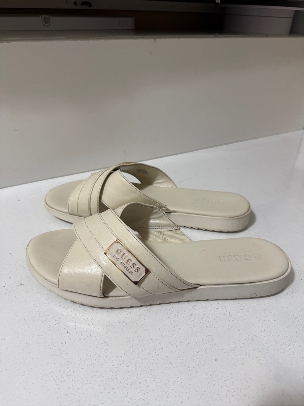 GUESS Women's Cream Slide Sandals - Elegant Cross-Strap Comfort.Off-white color